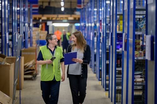 People working inside a warehouse