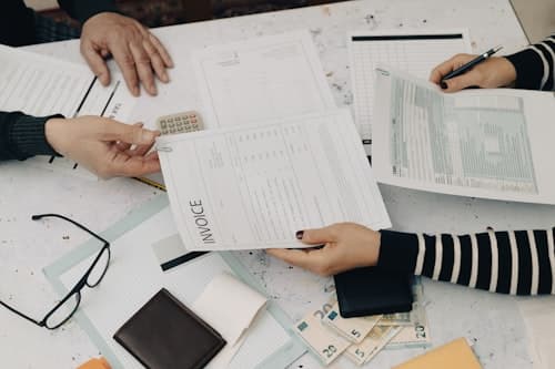 People reviewing paperwork and financial documents